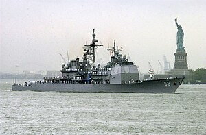 USS Anzio sails past the Statue of Liberty.