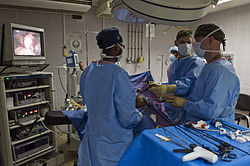 Endoscopy surgery US Navy 081117-N-7526R-568 Cmdr. Thomas Nelson and Lt. Robert Roadfuss discuss proper procedures while performing a laparoscopic cholecystectomy surgery.jpg