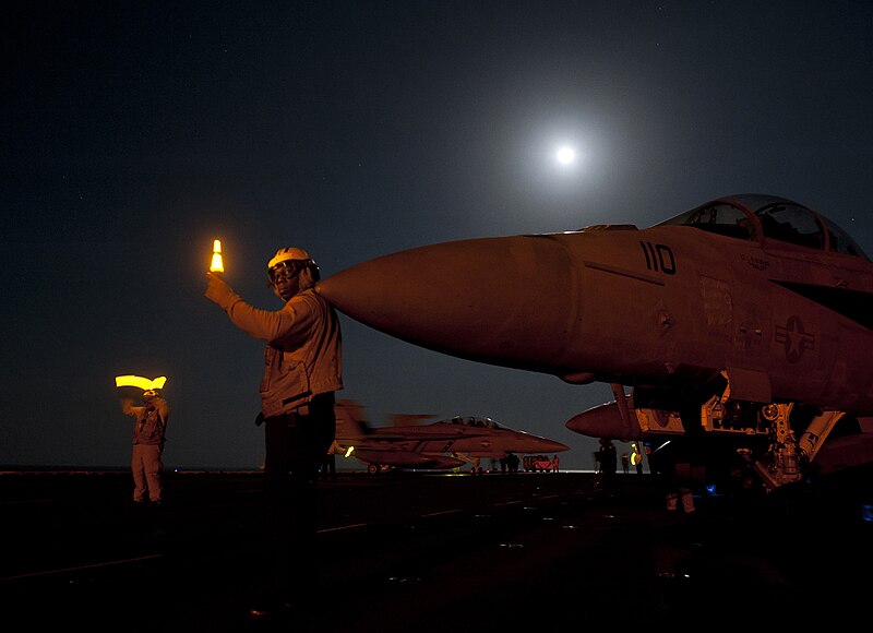 File:US Navy 120111-N-DR144-167 Flight deck personnel position aircraft after a recovery cycle on the flight deck aboard the Nimitz-class aircraft carri.jpg