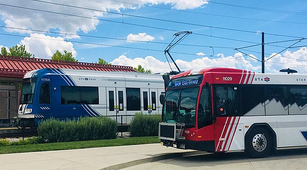 Bus and TRAX train at the 2700 West Sugar Factory Road station