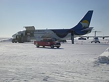 Unloading cargo from a Canadian North flight at Cambridge Bay Airport. The airport serves as a secondary hub
 for Canadian North. Pre-merger livery.