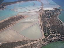 Aerial view of the town's site with salt crystallisation ponds Useless loop from the air 2008.jpg