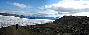 On one of the valley glaciers of the Breiðabunga, in the background on the far right the rock needle of Vestrahorn near Höfn