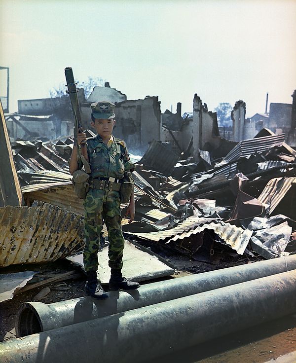 A 12-Year Old Child Soldier of the Airborne Division Holds a M79 Grenade Launcher.