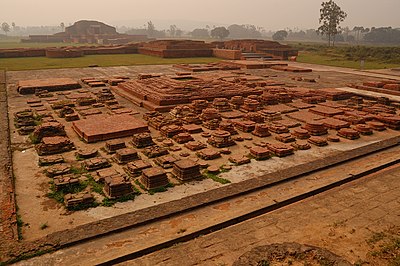Landscape of Vikramashila university ruins, the seating, and meditation area. It was one of the most important centers of learning, during the Pala Empire, established by Emperor Dharmapala. Atiśa, the renowned pandita, is sometimes listed as a notable abbot.[83]