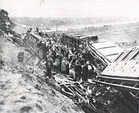 Damage surveyed following a train crash near Weesp, Netherlands. Weesp 1918 Train Disaster.jpg