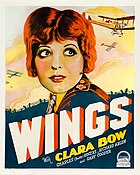 The theatrical poster of Wings. It focuses on Clara Bow, with war planes in the background.