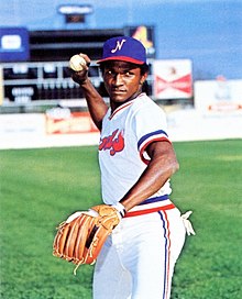 A baseball player in white