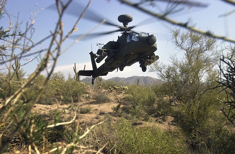 File:A US Army (USA) AH-64D Apache Longbow helicopter, armed with AGM-114 Hellfire air-to-ground missiles and 2.75-inch rocket pods hovers from a concealed position, during flight test c - DPLA - b297b4f3936541c31bd2177a08e87f2e.jpeg