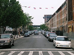 Puerto Rican flags fly above a side street in Bushwick.