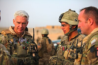 A British commissioned officer and warrant officer in Afghanistan. British army Lt. Col. Alistair Aitken, commanding officer, Combined Forces Lashkar Gah, and Warrant Officer Evan Philbin, with Alpha Company, 4th Battalion, Royal Regiment of Scotland, discuss mission objectives 110716-M-SM240-701.jpg