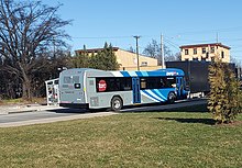 Blue-and-gray bus, seen from behind