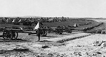 British artillery battery on Mount Scopus in the Battle of Jerusalem, 1917. Foreground, a battery of 16 heavy guns. Background, conical tents and support vehicles. Capture of Jerusalem 1917d.jpg