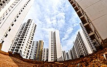 Unoccupied residential complexes in the Chenggong District, Kunming, China Chenggong, Kunming, Yunnan province.jpg