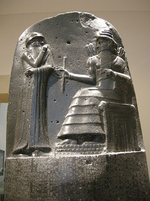 The Code of Hammurabi stela depicts the god Shamash holding a staff.