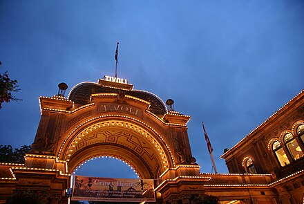 The Tivoli amusement park's main entrance at nighttime