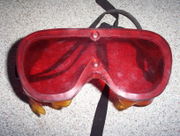 Dark adaptor goggles are used at night prior to going outside to adapt the eyes to the dark.