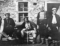 Shepherd in a sheepskin cloak with some men from Štirovica, 1907
