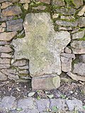 Enclosure walls and a walled-in stone cross