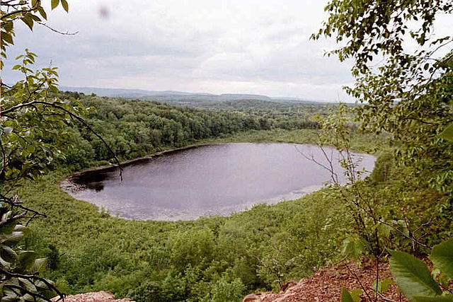 View of Snake Pond and the distant Westfield countryside from East Mountain in Holyoke