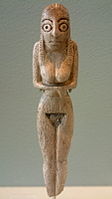 Дерев'яна статуетка жінки з поховання Бадарійської культури, Лувр