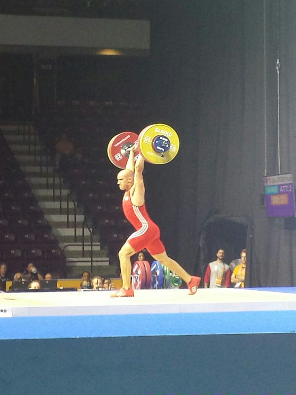 Francis Luna-Grenier lifts during the men's 69 kg weightlifting competition.