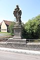 Bridge figure on inscription base