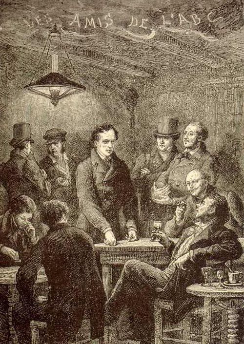 Enjolras at a meeting of the Friends of the ABC (seated, right)