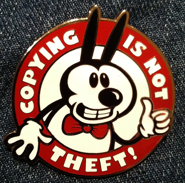 "Copying is not theft!" badge with a character resembling Mickey Mouse in reference to the "in popular culture" rationale behind the Sonny Bono Copyri