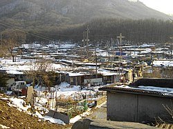 同じ江南区に存在するタルドンネの九龍村（2013年時点）