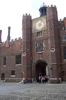 The clock face in the tower Hampton court courtyard.jpg