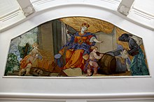 in a curved stucco cartouche a colorful ceiling painting with Maria in the center