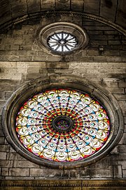 Gothic rosette, and stained glass, as a part of the facade of St. Jacob Cathedral in šibenik, Croatia. Photographer: Mladen Bozickovic