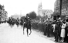 In 1921, Major Gyula Ostenburg-Moravek led a detachment of mounted gendarmes through Sopron in support of the West-Hungarians who were protesting the Trianon Treaty, which would turn over West Hungary to Austria. Hungarians Protest Trianon, Sopron, 1921.jpg