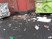 Hypodermic needles scattered amidst trash on Station Street near Pacific Central Station