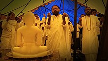 Jain pilgrims paying obeisance to Tirthankar Rishabhdeva, and reciting the Bhaktamara Stotra near Kailash.