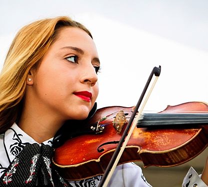 Julie Castillo, 15 years old, plays the violin for the Castillo Kids. She is currently attending high school and is interested in seeing the band’s growth and development.