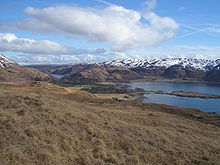 Lochbuie from the west with Loch Uisg at left, Moy Castle at centre, Eilean Mòr to the right and Druim Fada beyond.