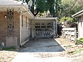 Garage with graffiti "Make Levees, Not War" on flooded house some 1 & 1/2 blocks from London Avenue Canal breech. Note high water lines.