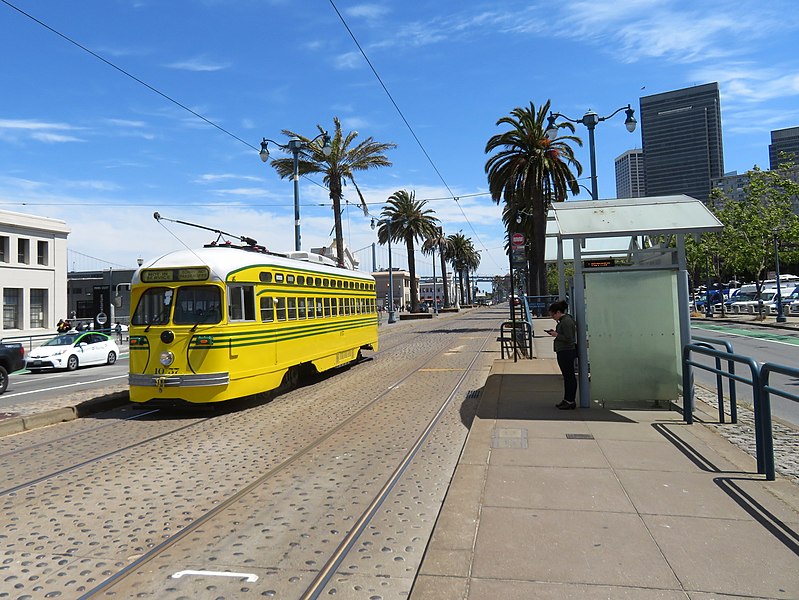 File:Muni 1057 passing The Embarcadero and Green station, May 2019.JPG