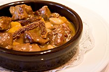 A serving of the sweet and sour lamb dish mutancana, prepared with dried figs and apricots Mutancana.jpg