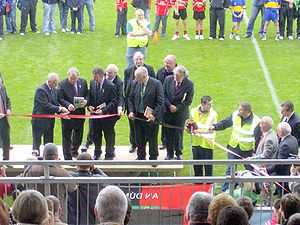 Brennan (second from left) cuts the ribbon at the official re-opening of Pairc Esler in Newry Nickey Brennan.jpg