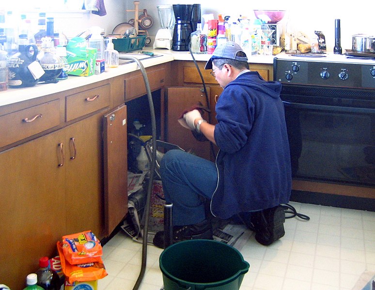 File:Plumber at work (retouched).jpg