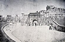 Puerta de Santiago, also known as Puerta de Tierra, today Plaza Colon, is the namesake of this subdistrict. Puerta santiago.jpg