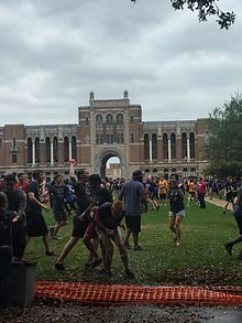 Rice University students participating in the Beer Bike water balloon fight in front of the Sallyport Rice Sallyport during Beer Bike Water Balloon Fight.jpg