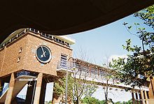 Clock tower with pedestrian bridge to the parking garage on Lakeland Street (also known as Railroad Avenue North) Ronkonkoma Station Clock Tower-Parking Garage.jpg