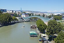 Tbilisi Peace Bridge and Kura River by Falco.jpg