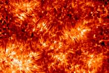 High-resolution observations of the solar chromosphere show hair-like spicules, here shown in a false colored image made in borderline ultraviolet radiation of calcium K-line. The Solar Chromosphere at the highest possible resolution.png