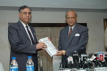 Justice U.C. Banerjee, presenting the final report of enquiry on Godhra fire incident to the Chairman of the Railway Board, J.P. Batra, in New Delhi in 2006 The high level committee on Godhra fire incident, headed by Justice U.C. Banerjee, Retired Supreme Court Judge, presenting its final report to the Chairman, Railway Board, Shri J.P. Batra in New Delhi on March 3, 2006.jpg