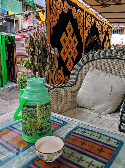 Relaxation Tibetan style: a thermos of salty, butter tea and nice comfy chair at a tea house in Lhasa